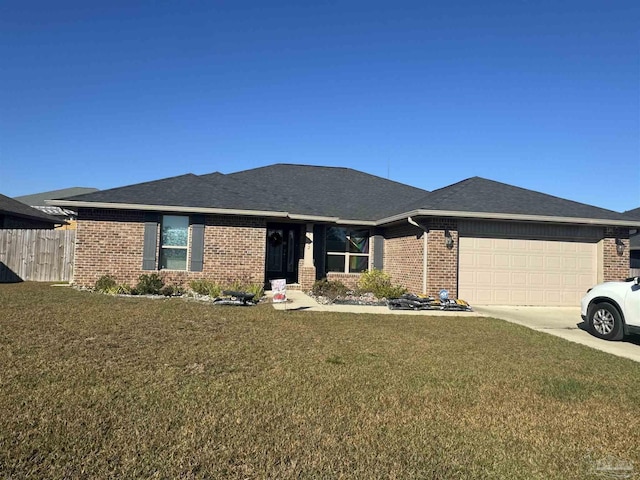 view of front of home featuring a garage and a front yard