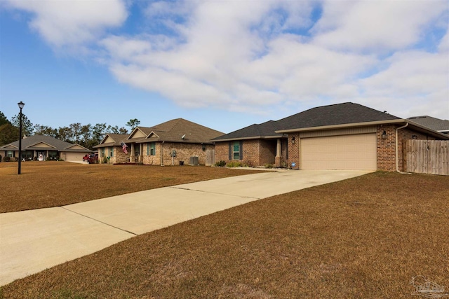 view of front of house with a garage and a front yard