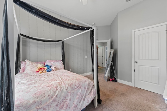 carpeted bedroom featuring baseboards and visible vents