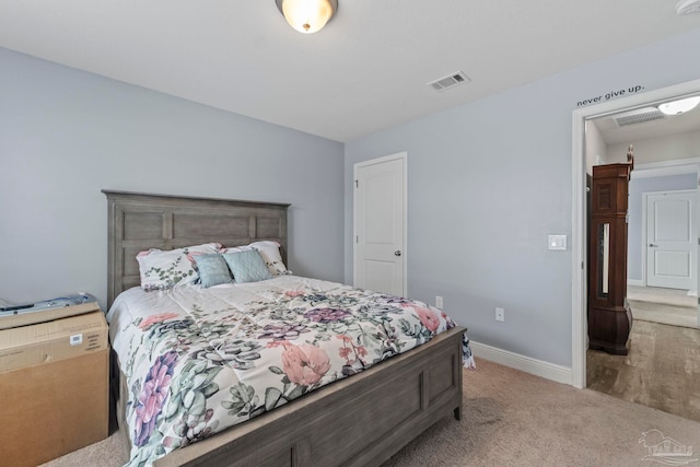 bedroom featuring visible vents, carpet, and baseboards