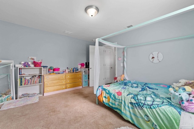 bedroom featuring light colored carpet and visible vents