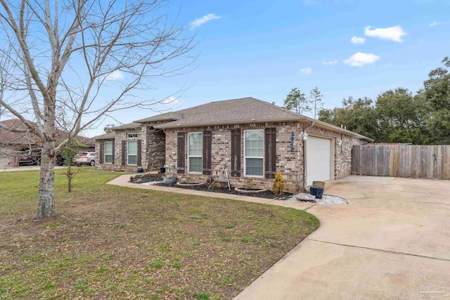 view of front of property with a front lawn, driveway, fence, an attached garage, and brick siding