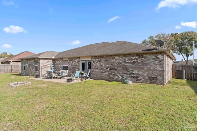 back of house with a patio, brick siding, and a fenced backyard