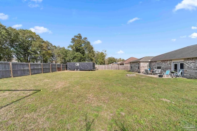 view of yard featuring a patio and a fenced backyard