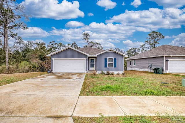 ranch-style house featuring a garage and a front yard