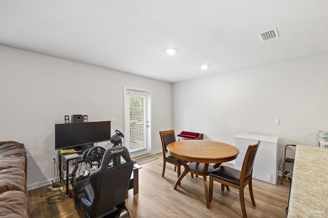 dining space featuring light hardwood / wood-style floors