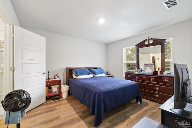 bedroom with light hardwood / wood-style floors