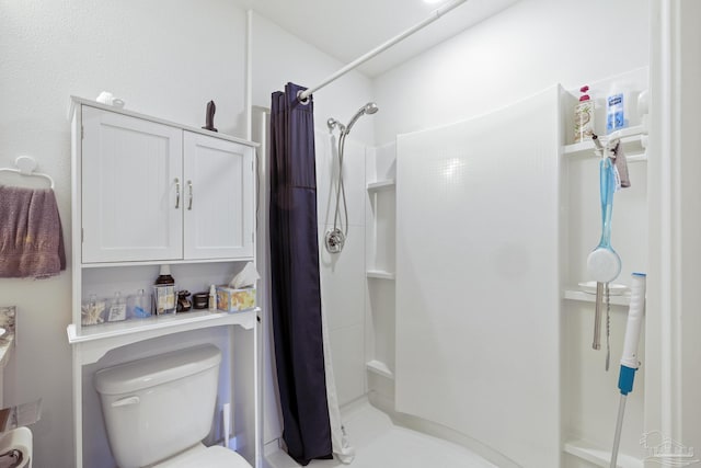 bathroom with walk in shower and toilet