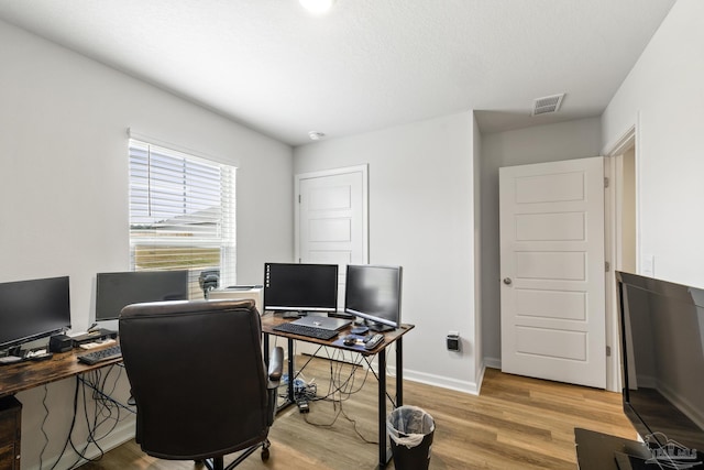 office space featuring light wood-type flooring