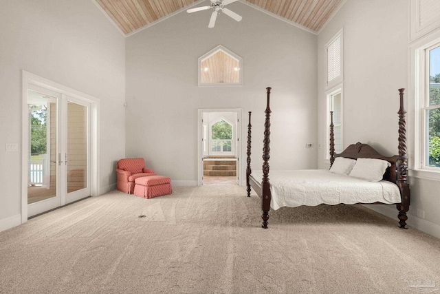 carpeted bedroom featuring wood ceiling, ceiling fan, access to exterior, high vaulted ceiling, and french doors