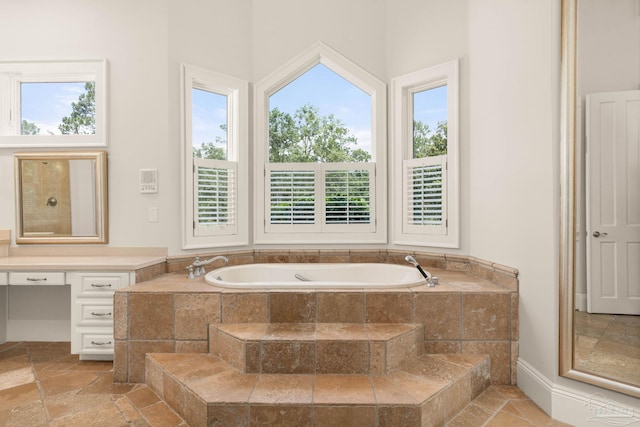 bathroom featuring tiled bath