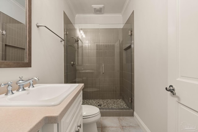 bathroom with crown molding, vanity, toilet, and a shower with door