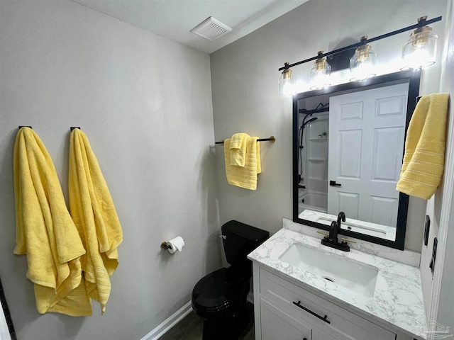 bathroom with toilet and vanity