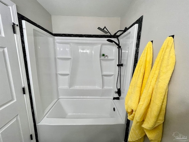 bathroom with shower / washtub combination