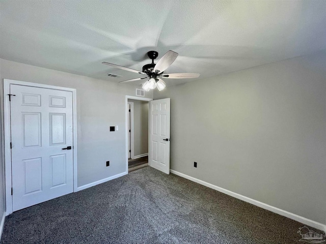 unfurnished bedroom featuring carpet floors and ceiling fan