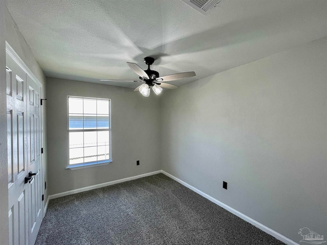 unfurnished room featuring carpet flooring, a textured ceiling, and ceiling fan