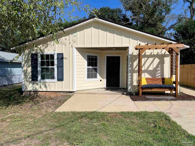 exterior space with a patio and a front yard