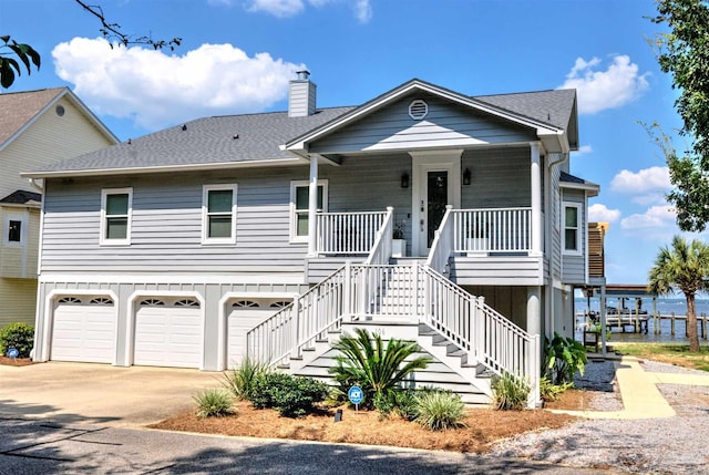 view of front of house featuring a garage and a porch