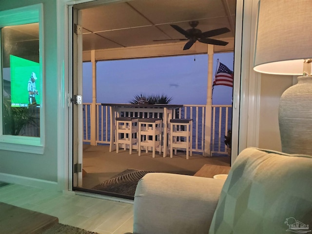 balcony at dusk with ceiling fan