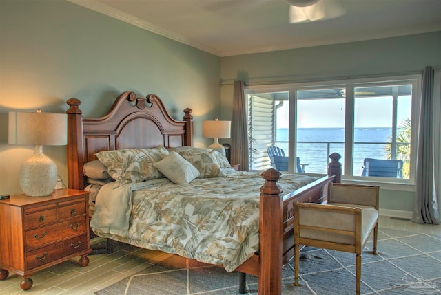 bedroom with ceiling fan, ornamental molding, hardwood / wood-style floors, and a water view