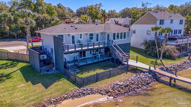 back of property featuring a yard, stairway, a fenced backyard, and a wooden deck