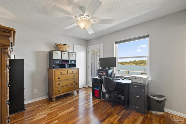 home office featuring baseboards, a textured ceiling, a ceiling fan, and wood finished floors