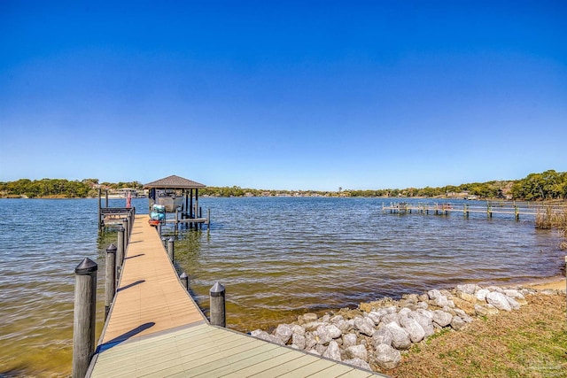 dock area featuring a water view and boat lift