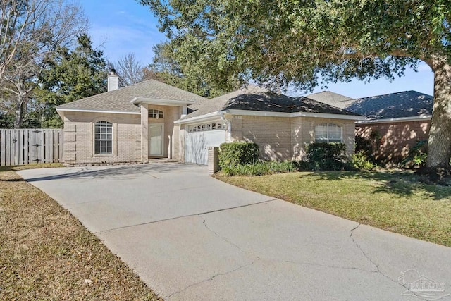 single story home with a garage and a front lawn