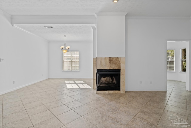 unfurnished living room with light tile patterned floors, ornamental molding, and a tile fireplace