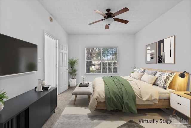 bedroom featuring light carpet and ceiling fan