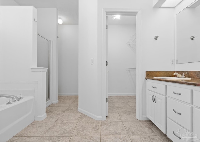 bathroom with vanity, tile patterned floors, and separate shower and tub