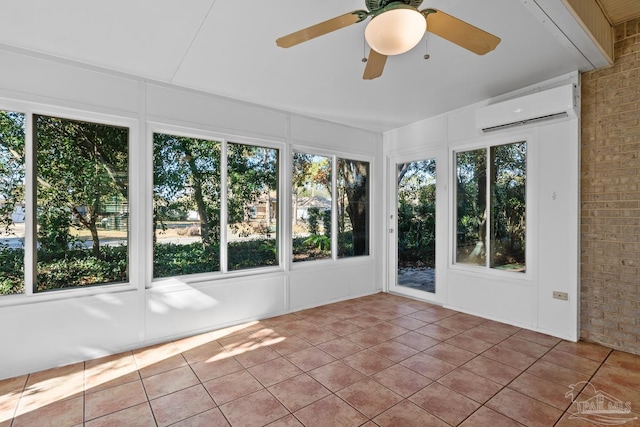 unfurnished sunroom featuring ceiling fan and a wall unit AC