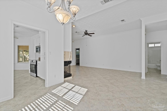 unfurnished living room featuring crown molding, light tile patterned floors, ceiling fan with notable chandelier, and a textured ceiling