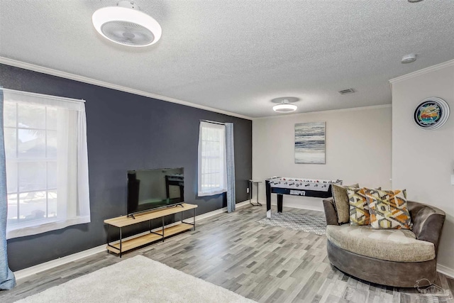 4122 Cobia St, Pensacola, FL 32507 - living area featuring wood finished floors, ornamental molding, a textured ceiling, and baseboards
