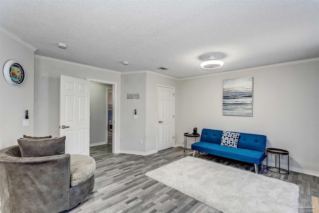 4122 Cobia St, Pensacola, FL 32507 - sitting room featuring wood finished floors, baseboards, crown molding, and a textured ceiling