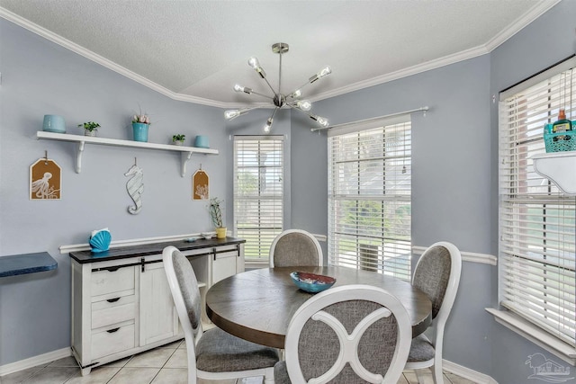 4122 Cobia St, Pensacola, FL 32507 - dining space with a chandelier, light tile patterned flooring, crown molding, baseboards, and a textured ceiling