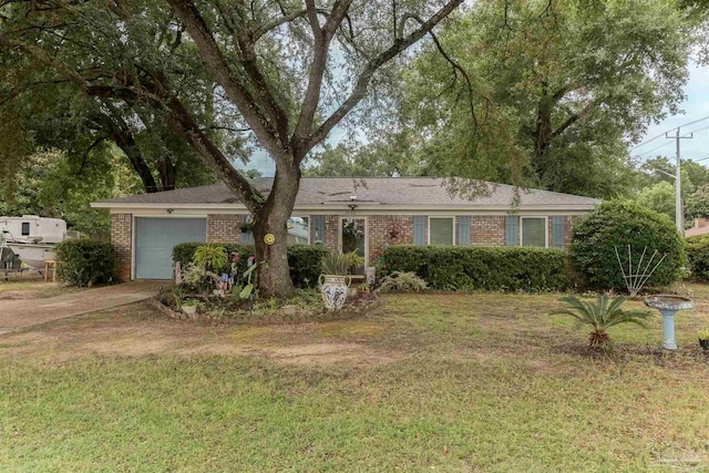 ranch-style home with a garage and a front yard