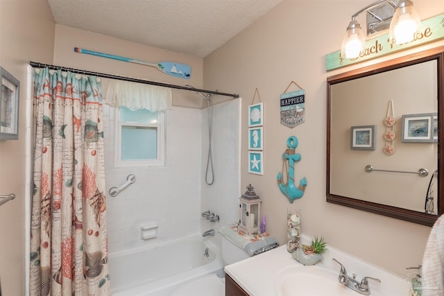 bathroom with shower / bath combo, a textured ceiling, and vanity