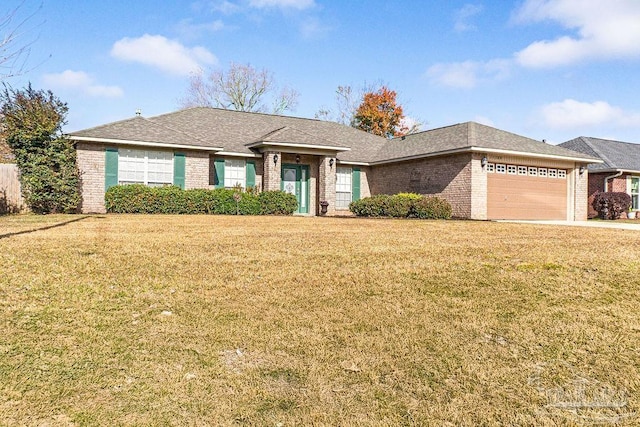 single story home with a garage and a front lawn