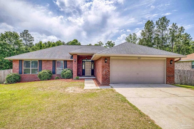 single story home featuring concrete driveway, an attached garage, fence, brick siding, and a front lawn