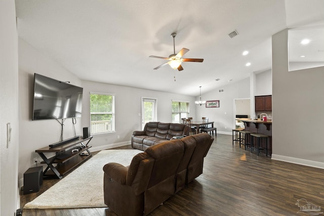 living room with dark wood-type flooring, baseboards, and ceiling fan with notable chandelier