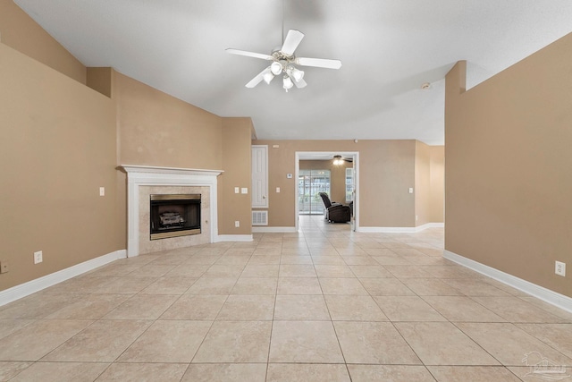 7850 Amethyst Dr, Pensacola, FL 32506 - unfurnished living room with ceiling fan, vaulted ceiling, a fireplace, light tile patterned flooring, and baseboards