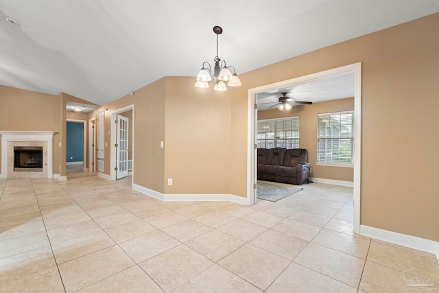 7850 Amethyst Dr, Pensacola, FL 32506 - spare room featuring light tile patterned floors, a chandelier, baseboards, a fireplace, and a ceiling fan