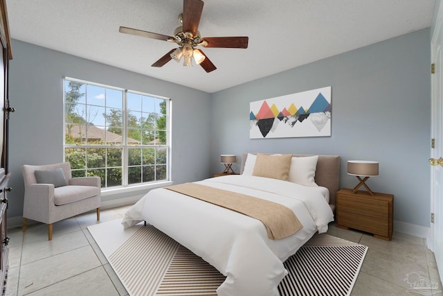 7850 Amethyst Dr, Pensacola, FL 32506 - bedroom featuring baseboards, light tile patterned floors, and a ceiling fan