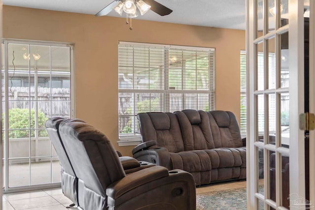 7850 Amethyst Dr, Pensacola, FL 32506 - living room featuring ceiling fan, light tile patterned floors, and french doors
