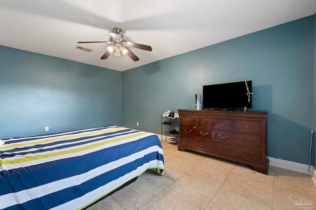 7850 Amethyst Dr, Pensacola, FL 32506 - bedroom with light tile patterned flooring, baseboards, and a ceiling fan