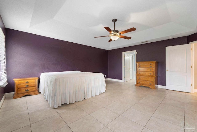 7850 Amethyst Dr, Pensacola, FL 32506 - bedroom featuring a raised ceiling, light tile patterned flooring, baseboards, and a ceiling fan