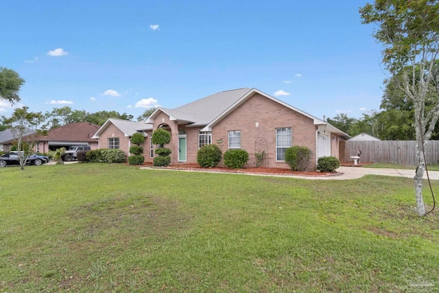 7850 Amethyst Dr, Pensacola, FL 32506 - view of front of house with driveway, brick siding, and an attached garage