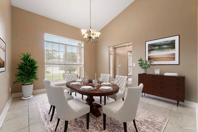 7850 Amethyst Dr, Pensacola, FL 32506 - dining space with a chandelier, healthy amount of natural light, baseboards, light tile patterned floors, and vaulted ceiling