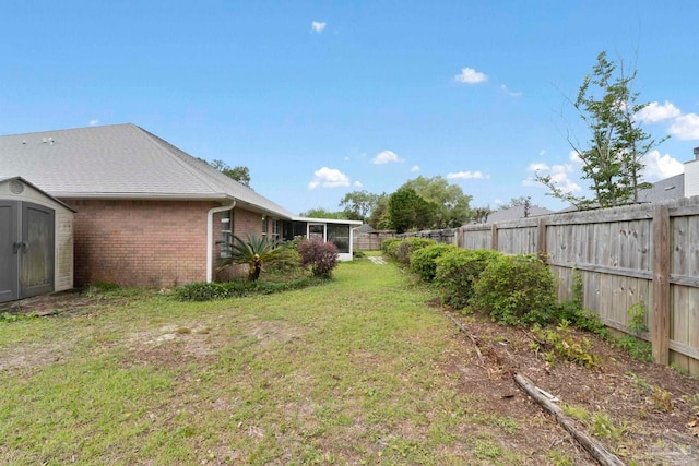 7850 Amethyst Dr, Pensacola, FL 32506 - view of yard with a storage unit and an outbuilding